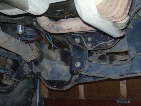 1991 Ford Bronco - Close-up view of the undercarriage, showing suspension and drivetrain parts.