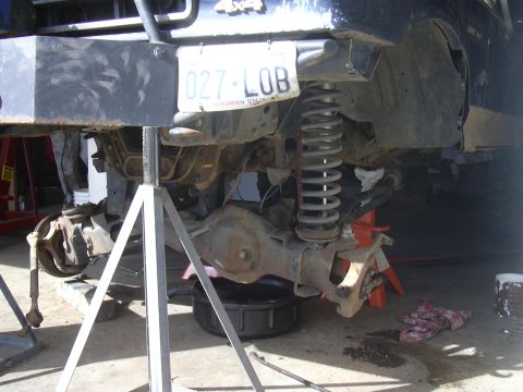 1991 Ford Bronco - Vehicle undergoing maintenance, showing suspension and axle components.