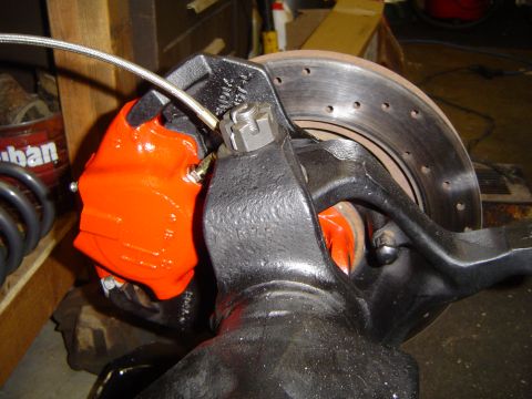 1989 Ford Bronco - Vehicle brake caliper and rotor assembly, likely from a project vehicle.