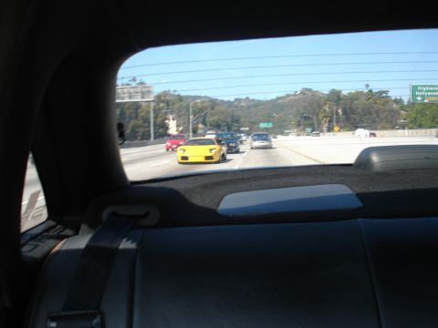 1993 Ford Taurus - Yellow sports car seen on the highway, not a 1993 Ford Taurus.