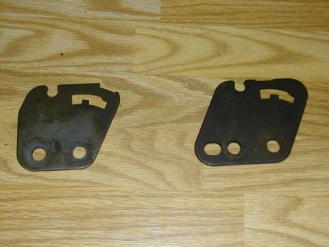1993 Ford Bronco - two transmission mounting plates, both came with shifters. both are for e4od dont know why they are different.. the one on the left is stam…