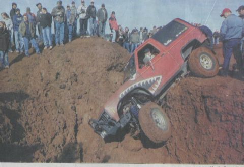 1991 Ford Explorer - This 1991 Ford Explorer is tackling a steep dirt obstacle during an off-road event.