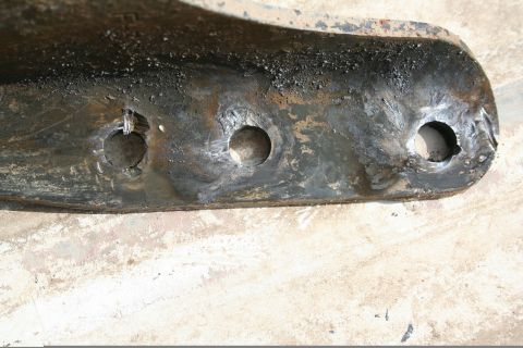1993 Ford F-350 - Cut the hanger rivets off with the plasma cutter. Worked well, but there was a little slag. Cleaned them up some with a grinder, but its ha…