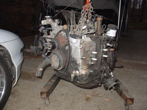 1986 Mazda RX-7 - Engine removed from a vehicle and mounted on an engine stand for repair or replacement.