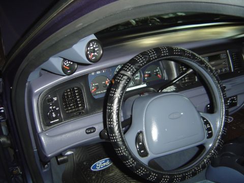 1998 Ford Crown Victoria - Interior view of a 1998 Ford Crown Victoria, aftermarket gauges on the A-pillar.