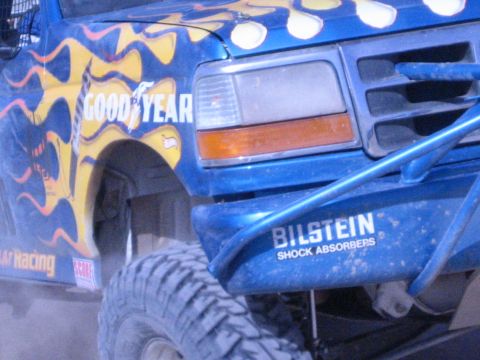 Detail of blue race truck front fender, Goodyear and Bilstein decals