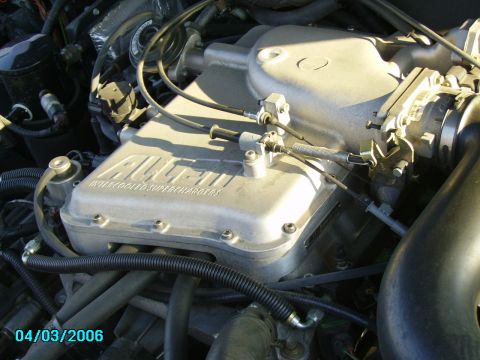 1998 Ford Crown Victoria - Close-up view of an engine an Allen Intercooled Superchargers unit, with a date stamp of 04/03/2006 visible.