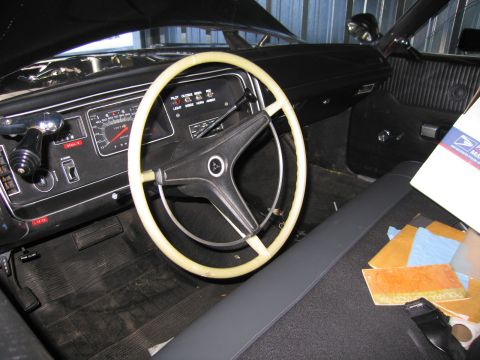 1991 Ford LTD Crown Victoria - vintage car interior featuring a white two-spoke steering wheel, classic gauge cluster, column shifter and dark dashboard.