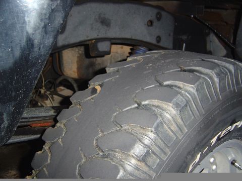1989 Ford Ranger - The tire tread is significantly worn, and suspension components are visible in this close-up shot.