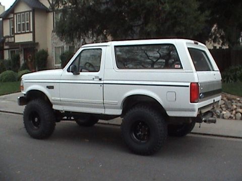 1994 Ford Bronco - This lifted 1994 Ford Bronco features large off-road tires and a two-tone rear accent panel.
