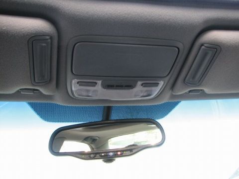 1998 Ford Crown Victoria - The interior overhead console and rearview mirror assembly are visible, integrated lights and buttons.