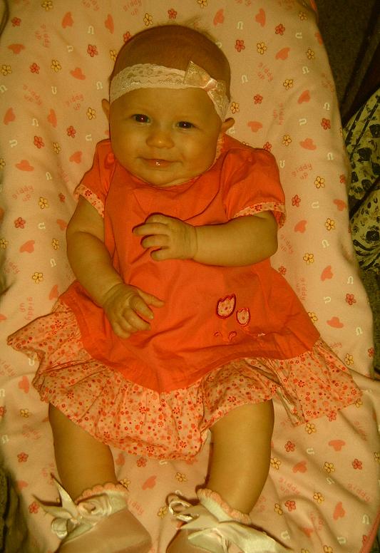 Baby in orange dress and headband