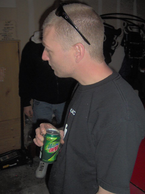 1996 Ford Probe - Man holding a can of Mountain Dew in what appears to be a garage or workshop setting.