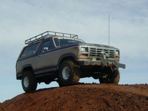 1994 Ford Explorer - This Ford Bronco is equipped with a roof rack and appears to be off-roading.