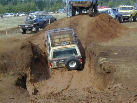1994 Ford Explorer - A 1994 Ford Explorer tackles a muddy obstacle course during an event.