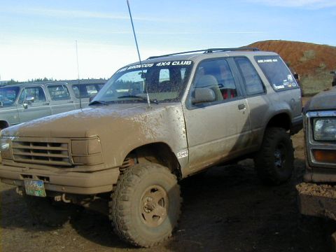 1994 Ford Explorer - Mud Fest 2006 event features a heavily soiled 1994 Ford Explorer, modified for off-road use.