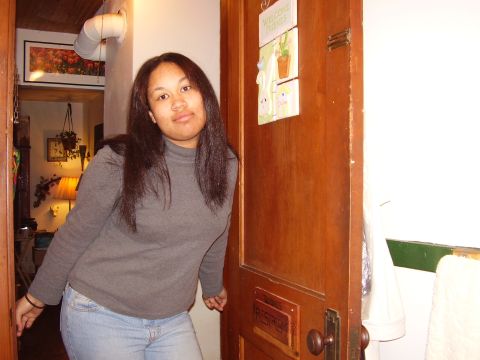 1997 Ford Taurus - A woman poses in a doorway, with a welcome sign on the door.