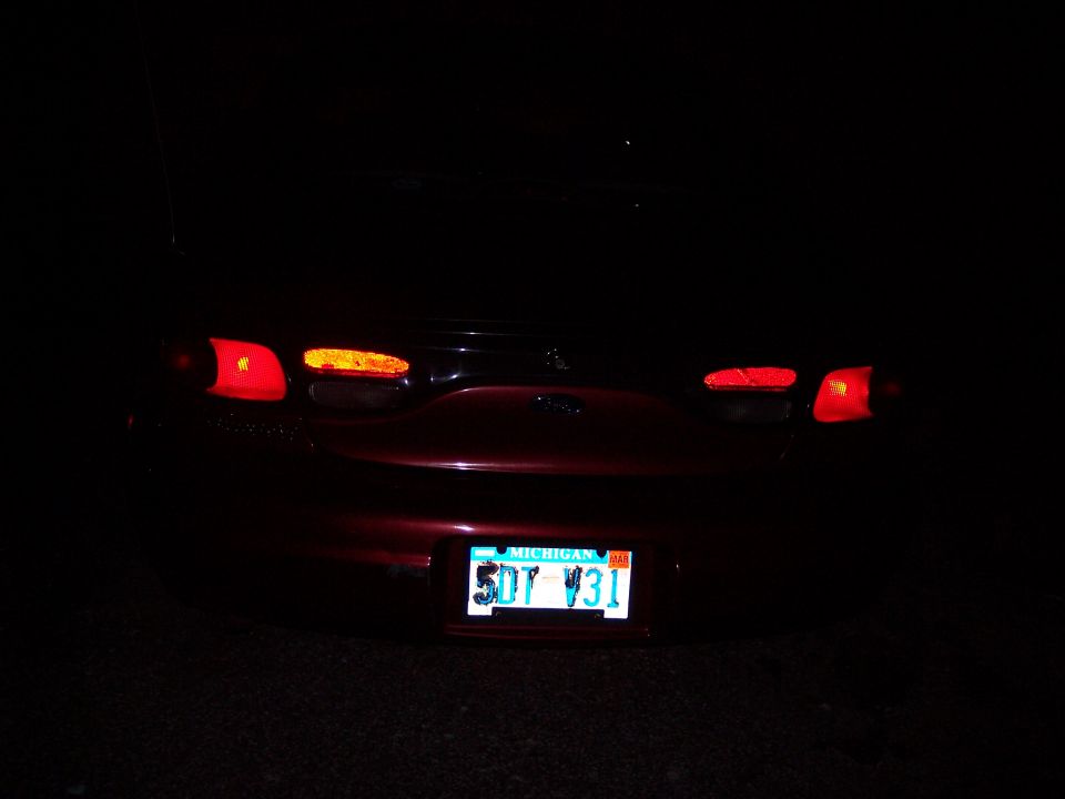 1999 Ford Taurus rear with taillights on and Michigan license plate 5DT Y31