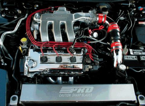 1995 Ford Probe - Close-up of a V6 engine bay, showing the intake manifold and various components.