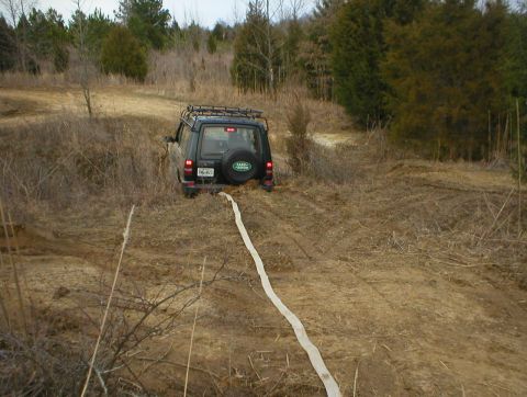 1983 Ford Bronco - Even this short LR Discovery couldn't make it across a narrow ditch, so I had to pull him back out.