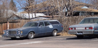 1972 Ford Ranchero - Two blue station wagons are parked next to each other on a sunny day.