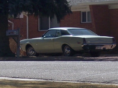 1972 Ford Ranchero - This 1972 Ford Ranchero is seen from the rear, parked in front of a residential brick house.