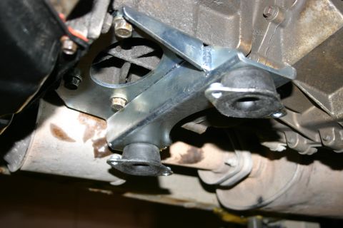 2003 Jeep TJ - Underside view of a vehicle's transmission mount bracket and exhaust system.