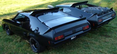 1972 Ford Ranchero - Two black 1972 Ford Rancheros are shown from the rear, one equipped with external tanks.