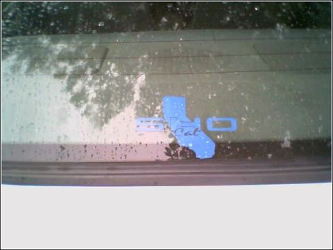 1993 Ford Taurus - Blue California sticker on the rear window of a vehicle.