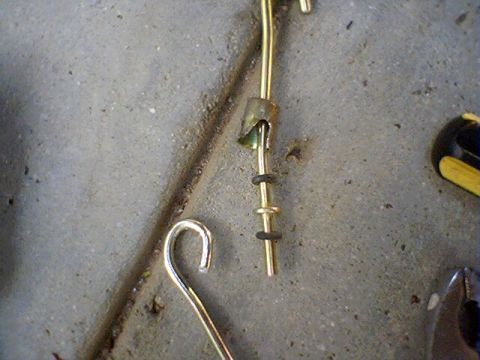 1994 Ford Bronco - This image shows a close-up of a metal rod with hooks and rings, not a 1994 Ford Bronco.