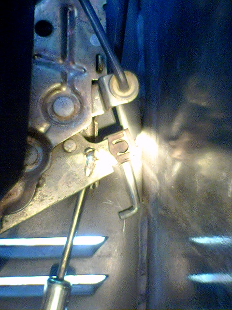 1994 Ford Bronco - Interior door latch mechanism showing linkage and pivot points.
