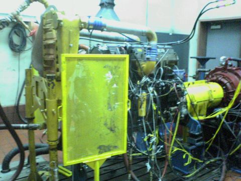 1986 Ford Bronco - This is a close-up view of an engine mounted on a test stand, surrounded by various hoses and wiring.