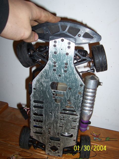 1994 Ford Probe - Underside view of an RC car chassis, showing the exhaust and suspension components.