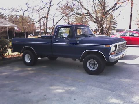 1979 Ford F-150 - This 1979 Ford F-150 pickup truck is seen from a 3/4 front angle, its grille and overall body style.