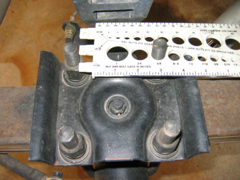 1985 Ford Bronco - A bolt gauge is used to measure the size of studs on a vehicle's suspension part.