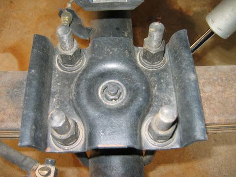 1985 Ford Bronco - Close-up of a rear axle suspension component, possibly from a Ford vehicle, with visible part number 'E22-FA'.