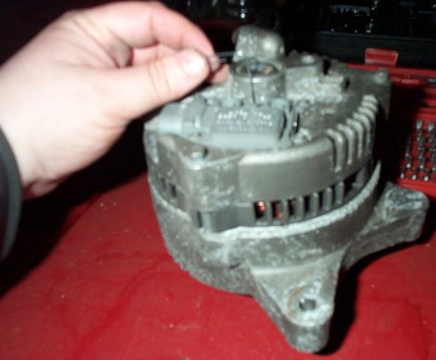 1993 Mercury Grand Marquis - When the regulator is in place and screws tightened, pull the paper clip out.