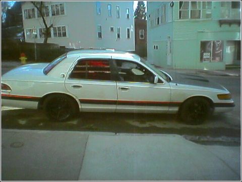 1992 Mercury Marquis - Red Rot-Y-L sittin low pro on 265/35/18's i blew one of my back tires because they werent wide enough so im getting 285/35/18's in the back.