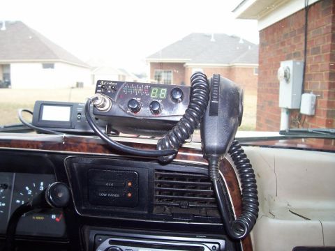 1989 Ford Bronco II - Interior view of a vehicle's dashboard, a CB radio and microphone setup.