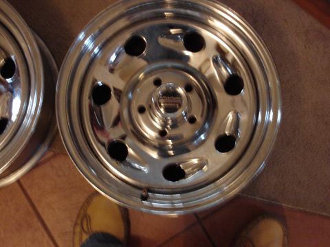 2000 Ford Crown Victoria - Two American Racing wheels are shown up close, resting on a carpeted surface.