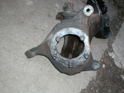 1979 Ford Bronco - This is a close-up view of a vehicle's spindle assembly, a component of the suspension system.