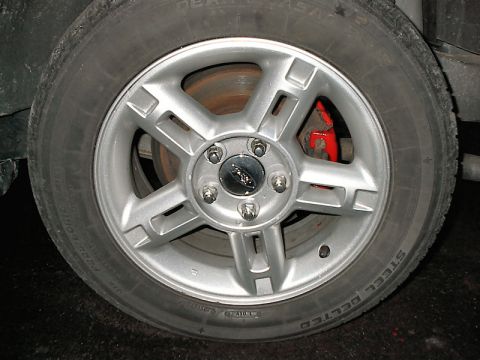 1985 Mercury Grand Marquis - Wheel and red brake caliper detail.
