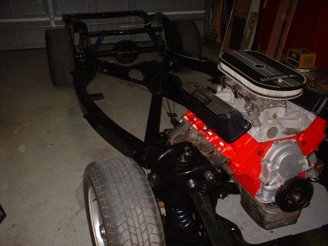 1964 Ford Galaxie - The chassis and engine of a car are shown, with "COBRA" branding visible on the air cleaner.