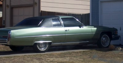 1972 Ford Ranchero - This green coupe with a black vinyl roof is likely a 1973 Cadillac Coupe DeVille, not the 1972 Ford Ranchero listed in the registry.