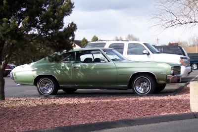 1972 Ford Ranchero - This 1972 Chevrolet Chevelle coupe is parked next to a white SUV.