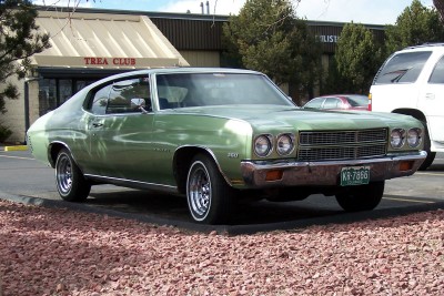 1972 Ford Ranchero - Green 1970 Chevrolet Chevelle coupe parked in a lot.