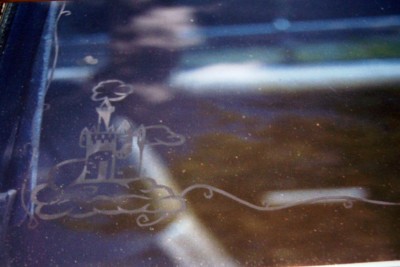 1972 Ford Ranchero - A decorative etching of a castle on clouds is visible on a dark, reflective surface.