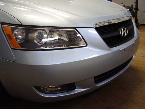 1997 Ford Taurus - The front grille and headlights of a silver Hyundai Sonata are shown up close.