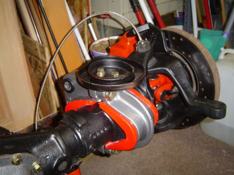1989 Ford Bronco - Close-up view of a vehicle's axle assembly, highlighting its mechanical components and brake system.