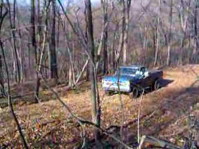 1976 Ford F-150 - trying to get my truck sideways on a "service road" in my side yard and then gettin it to break free but i was heading for a tree